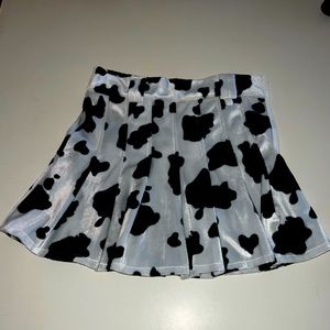 Cow print pleaded mini skirt! Thrifted, very much a statement piece!